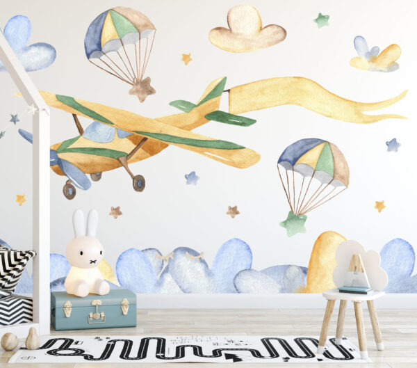 Watercolor airplanes and animals with parachutes among blue clouds wall decals